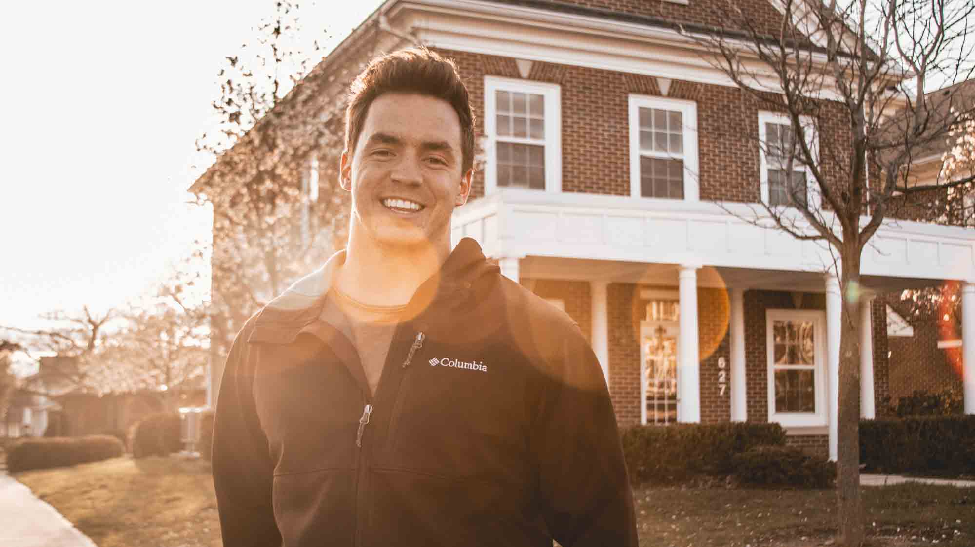 Man standing in front of house